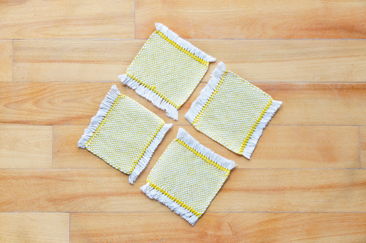 Cotton coasters, set of four, Pale Orange, Blue-grey, Brown, Bright Yellow, Bright Orange, Purple, handmade, natural fibres, hemstitched, made in Canada