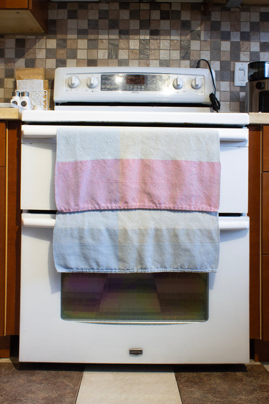 Cotton dish towel, colour blocked, blue, grey, pink, off-white, natural, handmade, natural fibres, hemstitched, hemmed, hand sewn hem, washer and dryer safe, woven in Canada