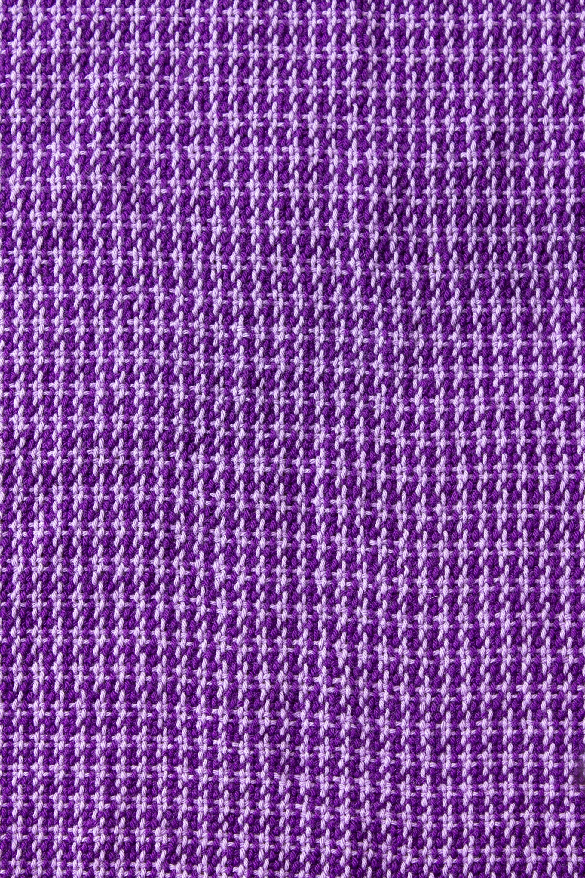 Cotton dish towel, purple houndstooth pattern, light purple, dark purple, handmade, natural fibres, locally sourced yarn, hemstitched, hemmed, hand sewn hem, washer and dryer safe, woven in Canada