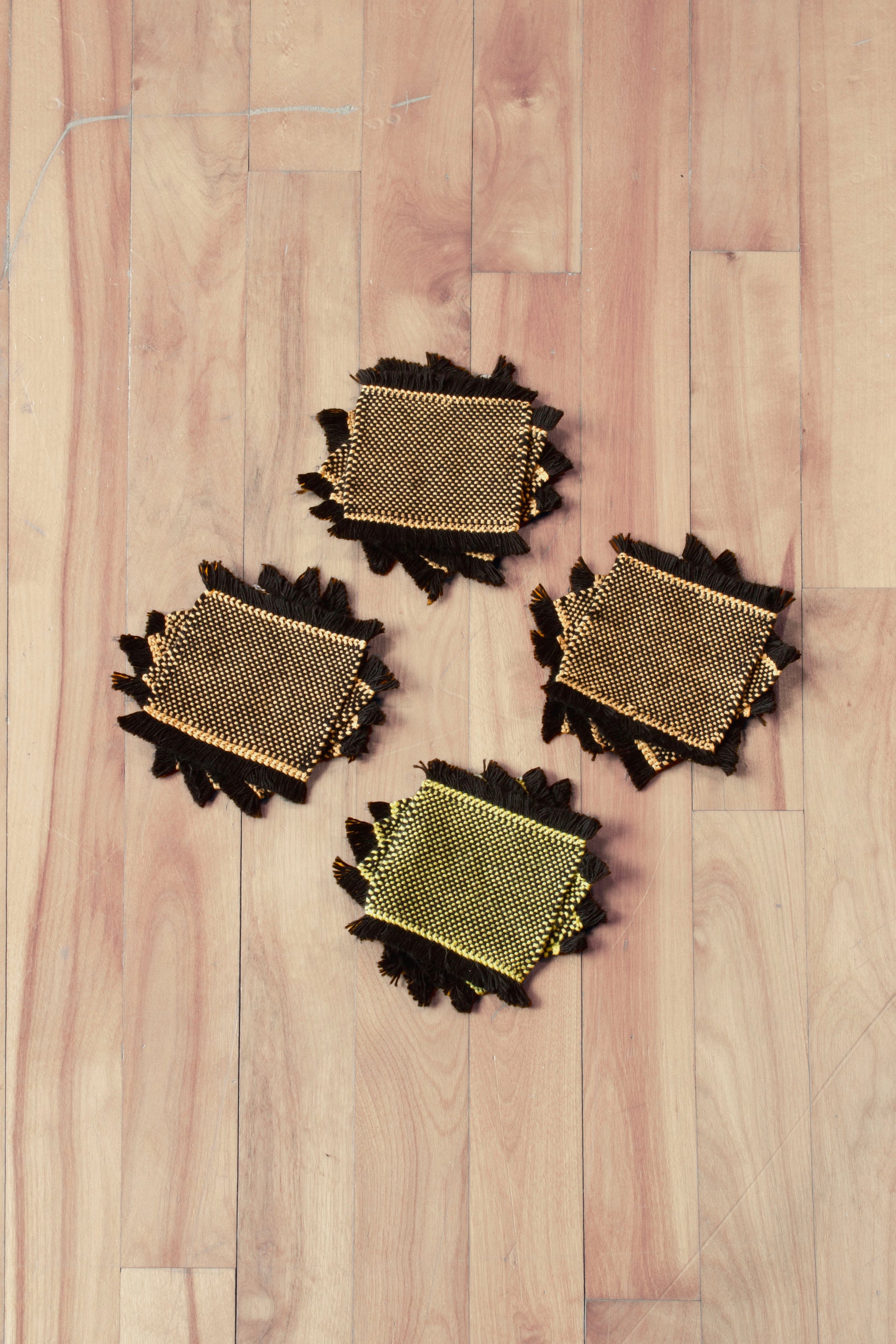 Cotton coasters: Set of four, hemstitched, black, orange, yellow, handmade, washer safe, soft, woven in Canada